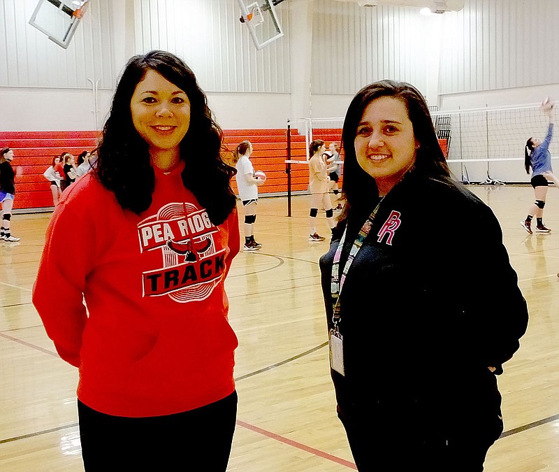 Lynn Atkins/ Heather Wade and Jessica Woods both have a lot of Pea Ridge athletic wear in their closets. Both graduated from Pea Ridge High School and then returned to teach and coach.