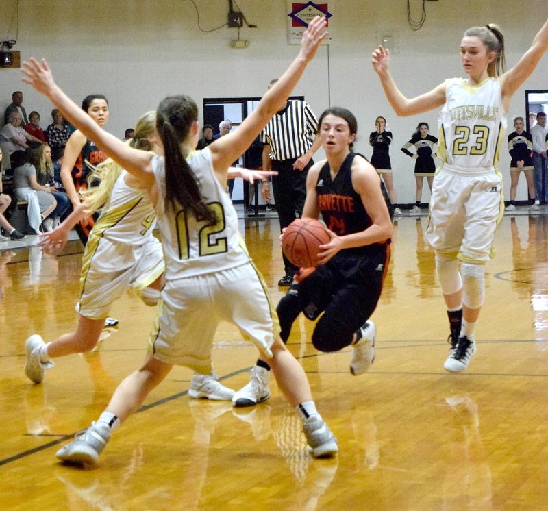 Photo by Mike Eckels Gravette&#8217;s Cally Kildow (24) weaves in and out of traffic as she sets up for a jumper from inside the lane during the Gravette-Pottsville first round contest of the 4A North Regional Tournament at the Tiger Dome in West Fork Feb. 23.