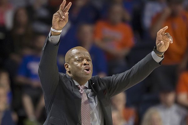 Arkansas coach Mike Anderson signals to his team during the second half of an NCAA college basketball game against Florida in Gainesville, Fla., Wednesday, March 1, 2017. Florida won 78-65. (AP Photo/Ron Irby)

