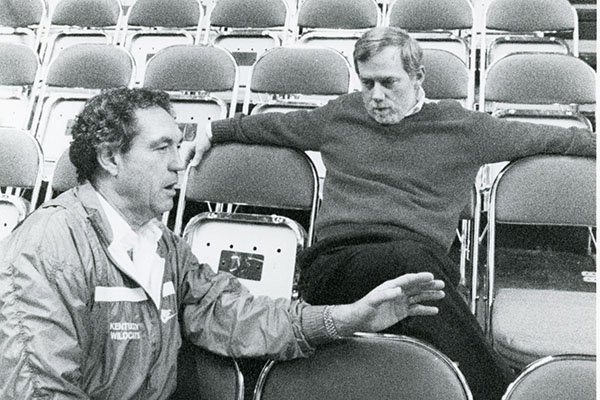 Arkansas Democrat columnist Wally Hall speaks with basketball coach Eddie Sutton in this undated photo. 