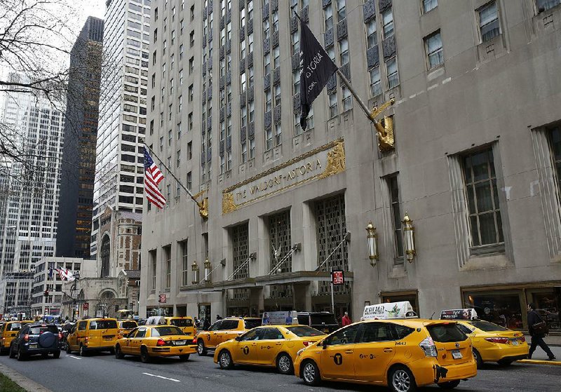 Taxis line up in front of the Waldorf Astoria hotel in New York on Tuesday. It closed Wednesday for two or three years for renovation. 
