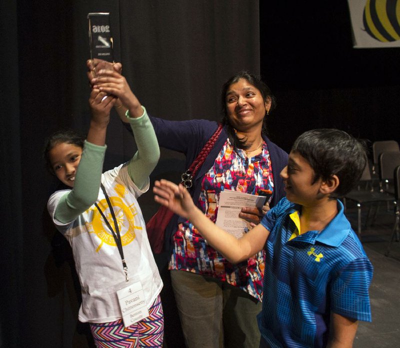Last year’s Arkansas State Spelling Bee winner, Pavani Chittemsetty, celebrates after correctly spelling “brigadier” to clinch the win. 
