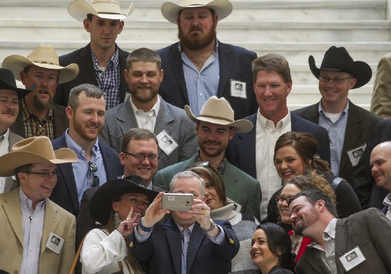 Members of the Arkansas Cattlemen’s Association pose for a picture Wednesday with Lt. Gov. Tim Griffin (holding phone camera) during a tour of the state Capitol. Griffin has been interviewed as a possible candidate for Army secretary and is definitely in the running, according to U.S. Sen. Tom Cotton.