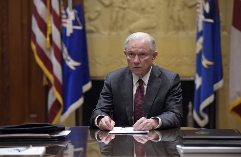 FILE - In this Feb. 9, 2017, file photo, Attorney General Jeff Sessions holds a meeting with the heads of federal law enforcement components at the Department of Justice in Washington. Sessions had two conversations with the Russian ambassador to the United States during the presidential campaign season last year, contact that immediately fueled calls for him to recuse himself from a Justice Department investigation into Russian interference in the election. The Justice Department said Wednesday night, March 1, 2017, that the two conversations took place last year when Sessions was a senator. (AP Photo/Susan Walsh, Pool, File)
