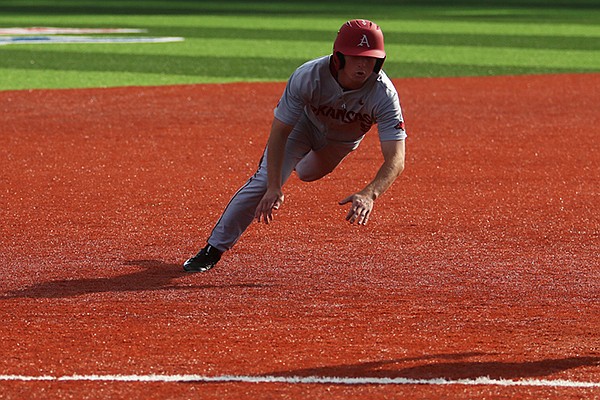 Arkansas shortstop Jax Biggers dives for third base during a game against Louisiana Tech on Wednesday, March 1, 2017, in Ruston, La. Biggers had four hits, including a home run as the Razorbacks won 13-10 after trailing by nine runs in the second inning. 