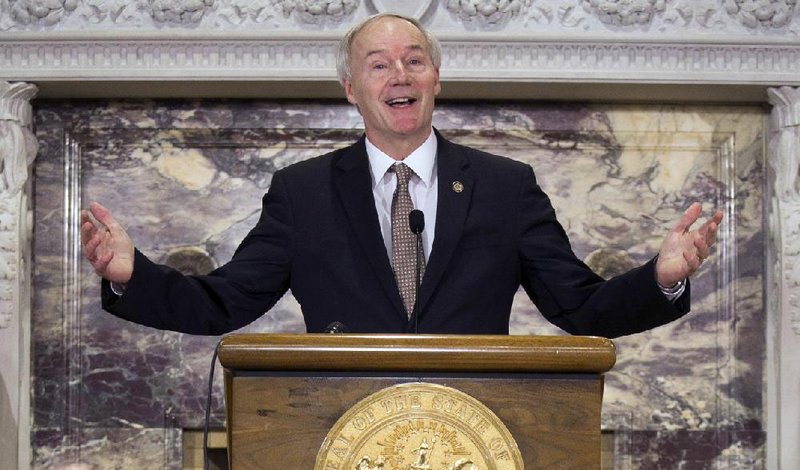 Gov. Asa Hutchinson, at a news conference Wednesday, speaks out in support of the bill to separate Robert E. Lee’s name from the holiday now shared with Martin Luther King Jr., setting a state memorial day for Lee in October.