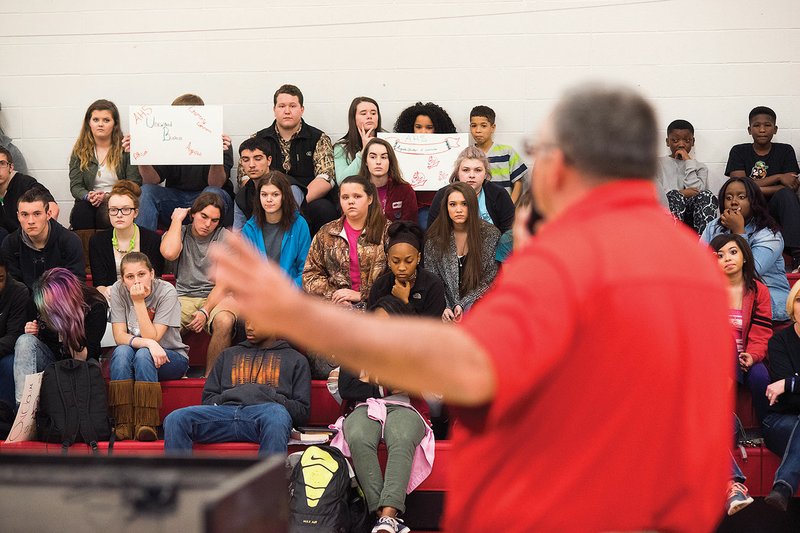 Rick Pilcher, the dean of students for the Augusta School District, speaks inside the old gym at Augusta High School. Recently, more than $200,000 was raised for a scholarship program for graduates, as well the donation of new iPads and gym equipment.