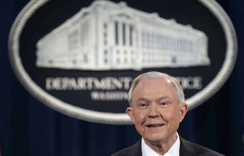 Attorney General Jeff Sessions listens during a news conference at the Justice Department in Washington, Thursday, March 2, 2017.