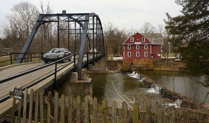 Two companies submitted bids Friday to repair the 109-year-old War Eagle Bridge in Benton County, seen in this December photo. 