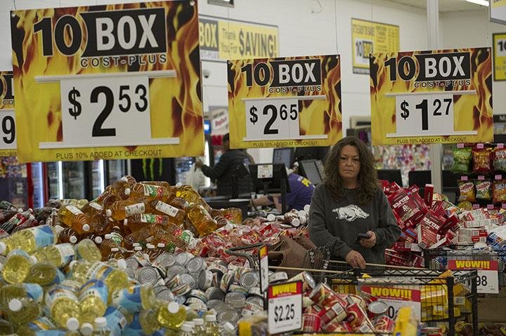 Donna Cunningham shops at 10 Box Cost-Plus in Springdale, where the shoppers also are the baggers.