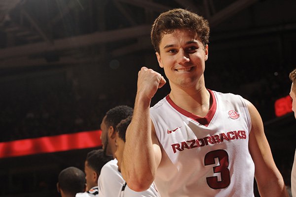 Arkansas guard Dusty Hannahs celebrates in the closing seconds against Georgia Saturday, March 4, 2017, during the second half of play in Bud Walton Arena in Fayetteville.