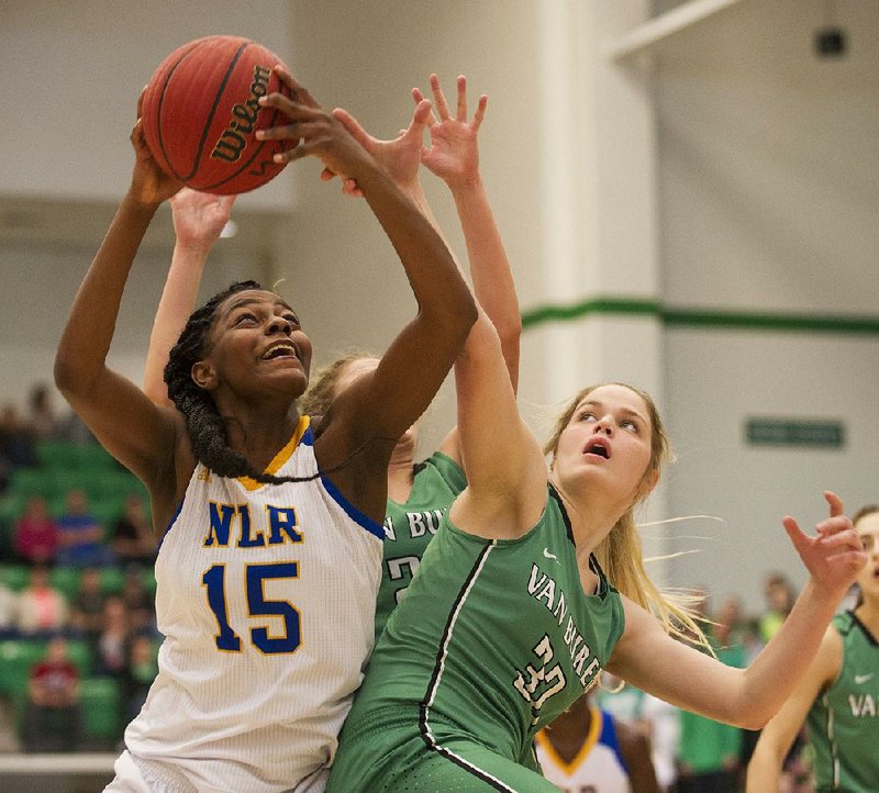 North Little Rock’s Yo’Myris Morris (15) comes down with a rebound in front of Van Buren defender Taylor Sutton during the Charging Wildcats’ 45-38 victory over the Pointers on Saturday at the Class 7A girls state basketball tournament in Van Buren.
