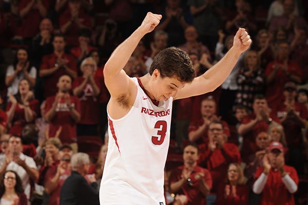 Arkansas guard Dusty Hannahs is applauded as he walks off the floor during a game against Georgia on Saturday, March 4, 2017, at Bud Walton Arena in Fayetteville. Hannahs tied for a game-high 15 points in his final home game for the Razorbacks. 