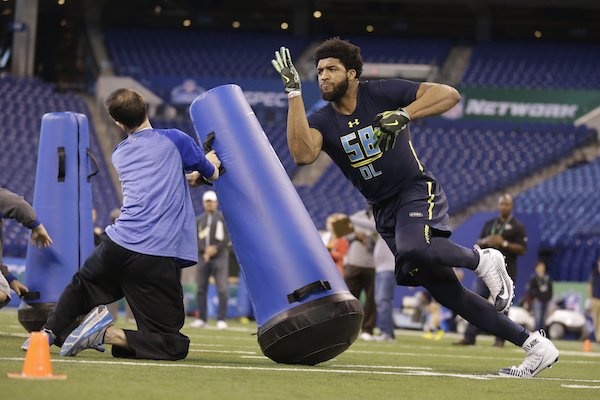 Arkansas defensive end Deatrich Wise runs a drill at the NFL football scouting combine in Indianapolis, Sunday, March 5, 2017. 