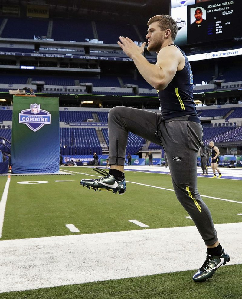 Wisconsin linebacker T.J. Watt works out at the NFL combine in Indianapolis. Watt is a brother of Houston Texans defensive end J.J. Watt.