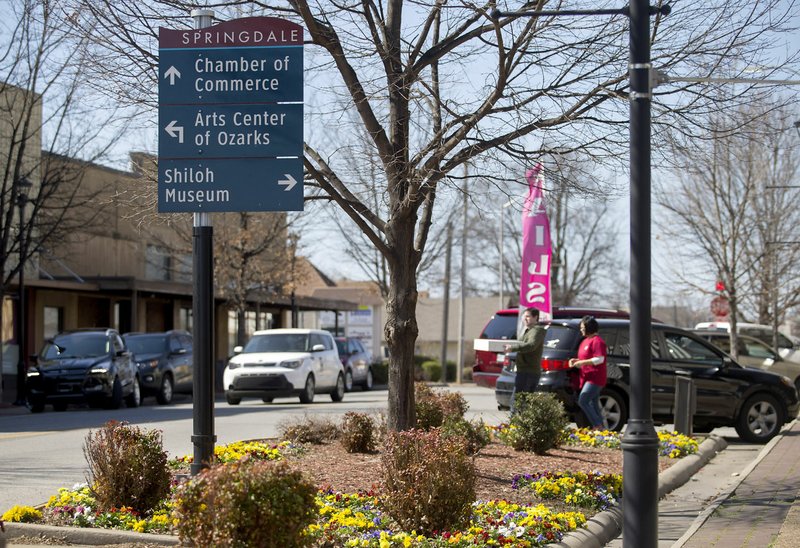 NWA Democrat-Gazette/JASON IVESTER Traffic moves along Emma Avenue in downtown Springdale.