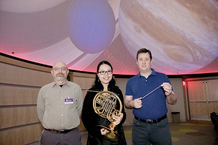 The Conway Symphony Orchestra will present The Planets at 7:30 p.m. Saturday in the Donald W. Reynolds Performance Hall at the University of Central Arkansas. The orchestra is partnering with the UCA Department of Physics and Astronomy for the event. Standing inside the UCA planetarium are Scott Austin, from left, director of astronomical facilities and associate professor of astronomy and physics at UCA; Yu-Hsuan “Vivian” Chang, winner of the 2017 UCA Concerto Competition; and Israel Getzov, CSO conductor and musical director.