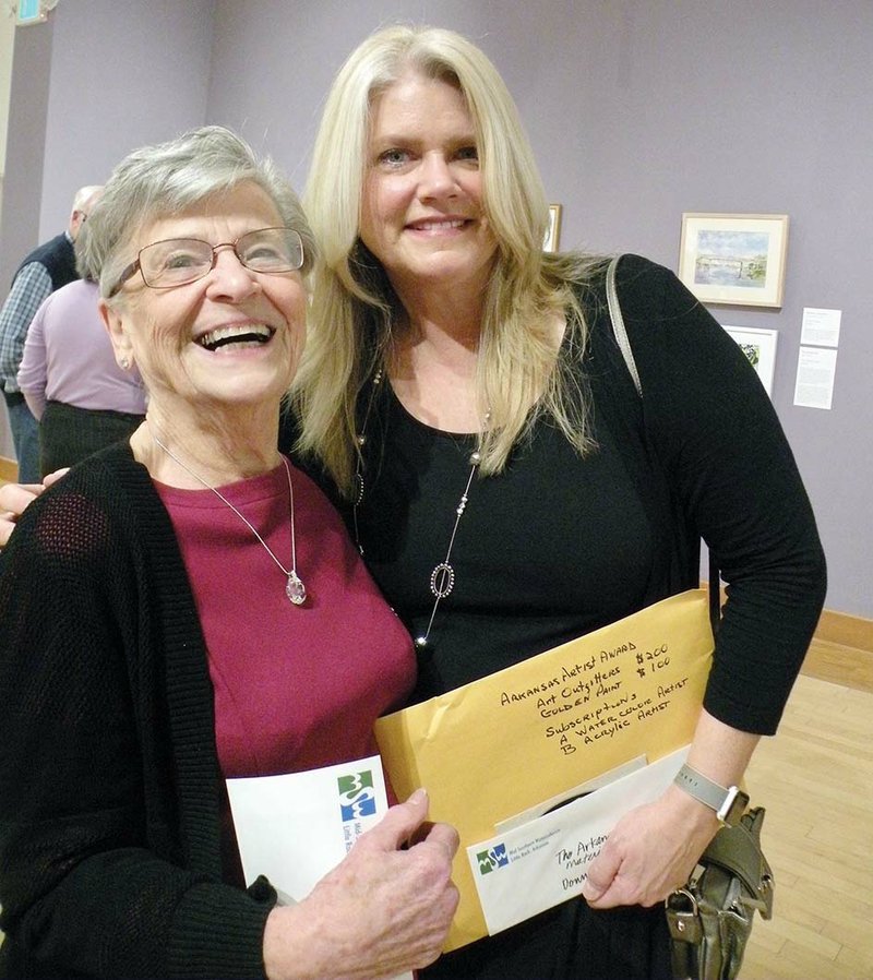 Mary Ann Stafford of Maumelle, left, and Donna Munn of Conway are all smiles following the announcement of their awards in the 2017 Mid-Southern Watercolorists Exhibition at the Arkansas Arts Center in Little Rock. Charlotte Rierson of Fairfield Bay also won an award but was unable to attend the opening ceremony Feb. 17.