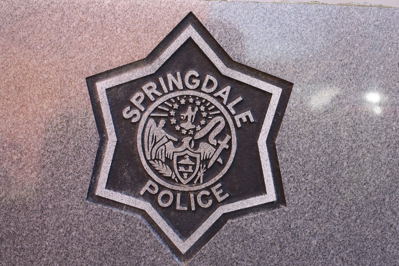 A Springdale Police Department logo.
