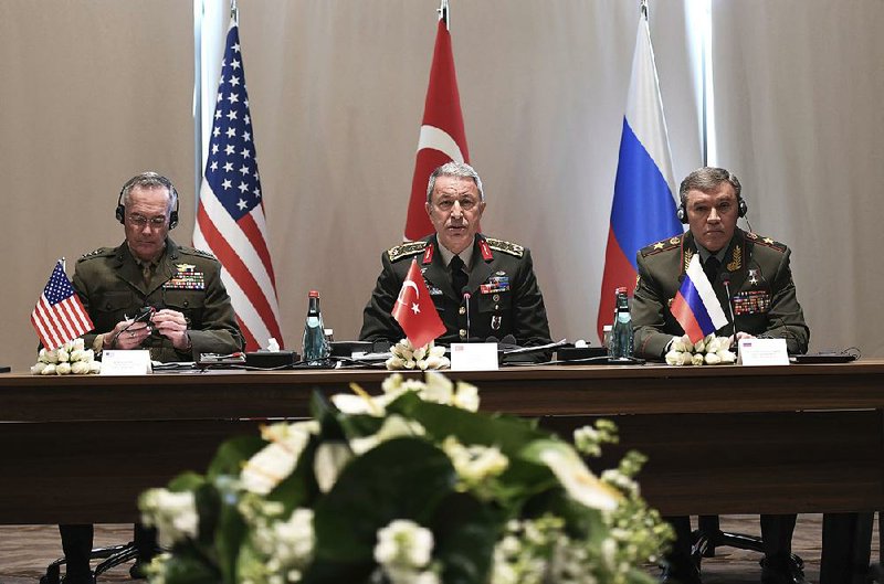 U.S. Chairman of the Joint Chiefs of Staff Gen. Joseph Dunford (from left), Turkey’s Chief of Staff Gen. Hulusi Akar, and Russia’s Chief of Staff Gen.Valery Gerasimov attend a meeting Tuesday in Antalya, Turkey.
