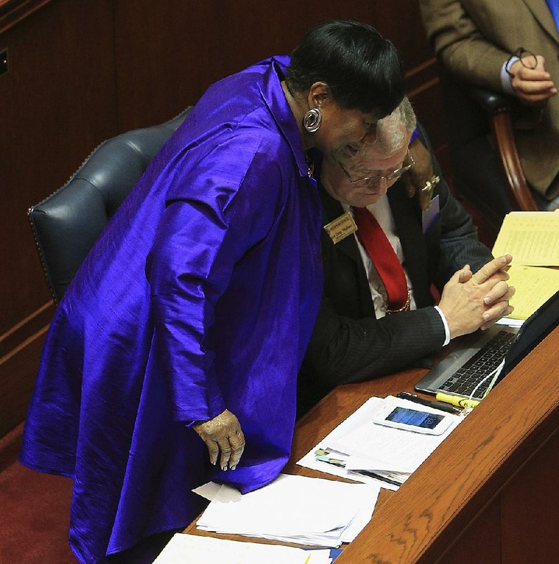 Sen. Linda Chesterfield hugs Sen. David Wallace on Tuesday after Wallace’s bill was approved on a voice vote.