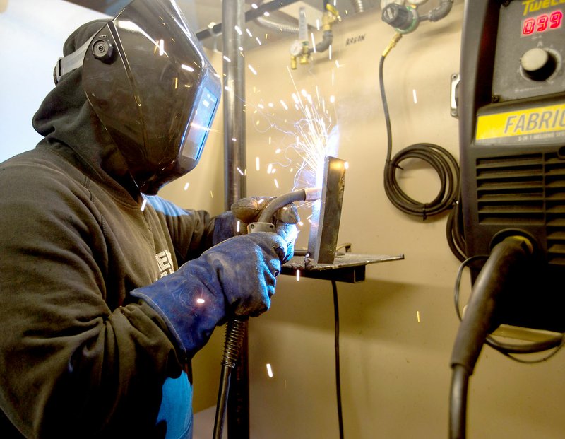Photo by Jason Ivester Skyler Adams, Gravette High senior, works on a welding project Feb. 16 during class at the Western Benton County Career Center in Gravette.