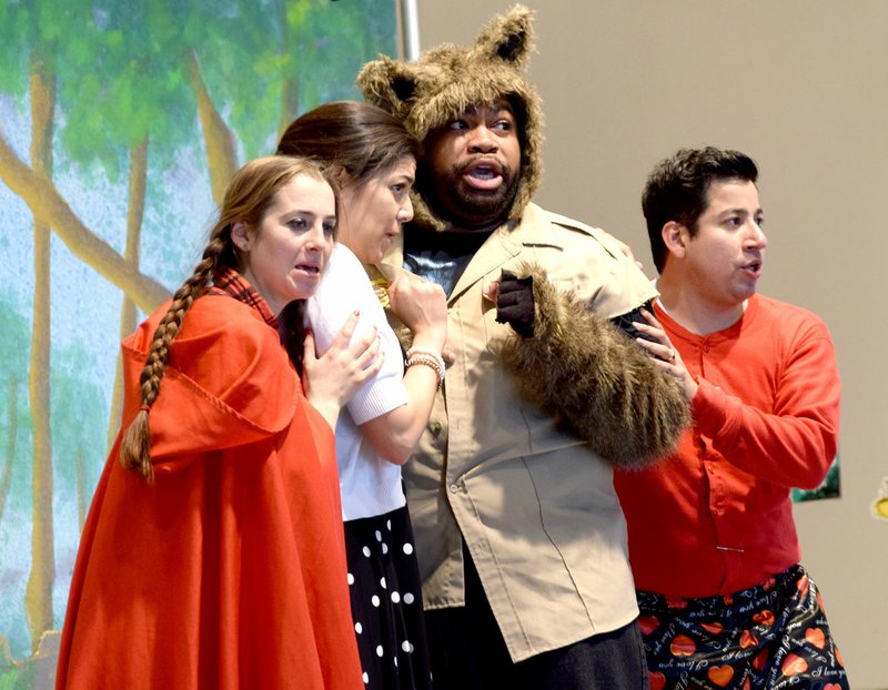 Photo by Mike Eckels Little Red (left), Mother Hood, Mr. BigBad and Ranger Dudley all cower together as they spot the woodman lurking nearby during the Tulsa Opera Company production of &#8220;Little Red&#8217;s Most Unusual Day&#8221; at Northside Elementary in Decatur Feb. 27.