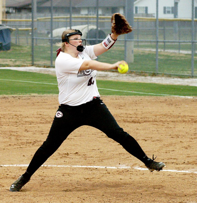 Photo by Randy Moll Alyssa Kelton prepares to throw a pitch for Gentry during the Feb. 28 home game against Springdale.