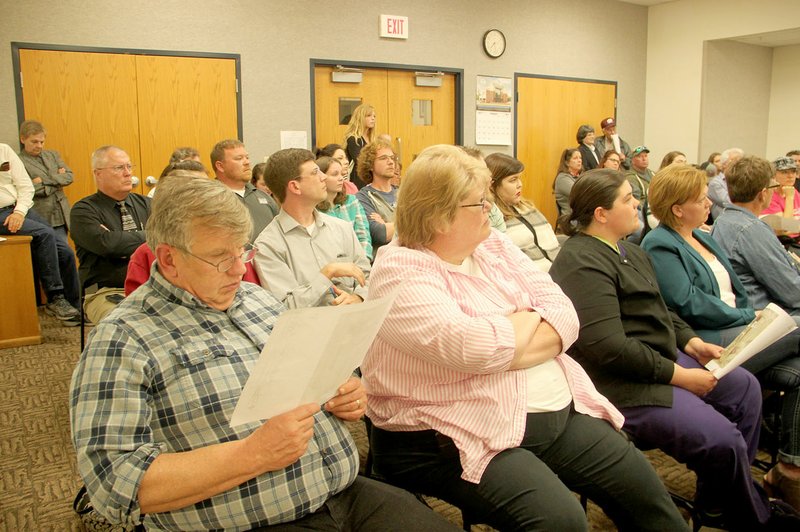 LYNN KUTTER ENTERPRISE-LEADER Farmington Planning Commission had standing-room only at its Feb. 20 meeting. Residents showed up to speak out against two items on the agenda: a preliminary plat for a residential subdivision on Sellers Road and a large-scale development plan for a new city public works building to be located on the northern edge of Creekside Park.