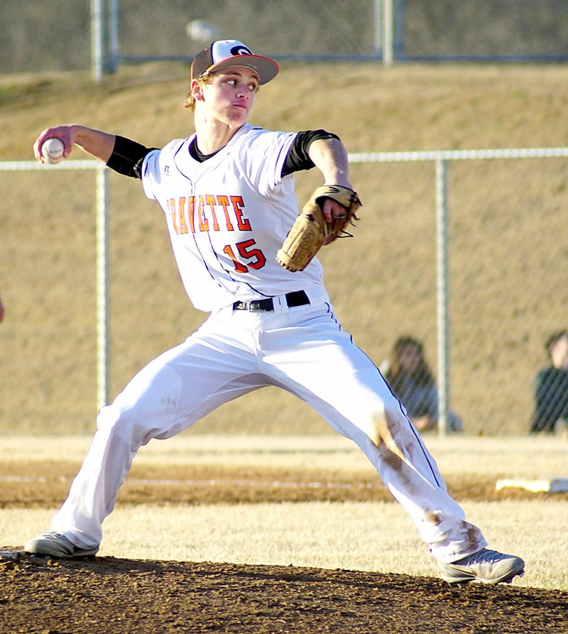 Photo by Randy Moll Gravette&#8217;s Hunter Cole winds up to throw a pitch against Elkins on Thursday.