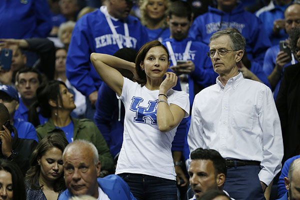 Actress and Kentucky fan Ashley Judd watches play against the Florida during the first half of an NCAA college basketball game in the quarter final round of the Southeastern Conference tournament, Friday, March 13, 2015, in Nashville, Tenn. (AP Photo/Steve Helber)
