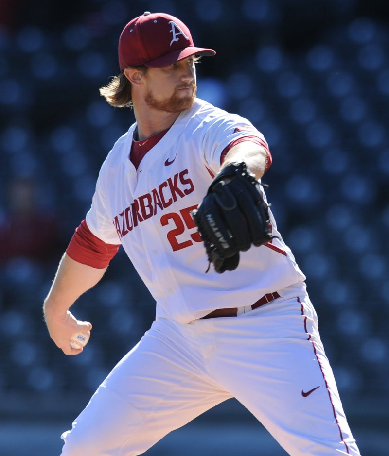 Arkansas starter Dominic Taccolini delivers a pitch Tuesday against Louisiana-Monroe at Baum Stadium. Visit nwadg.com/photos to see more photographs from the game.