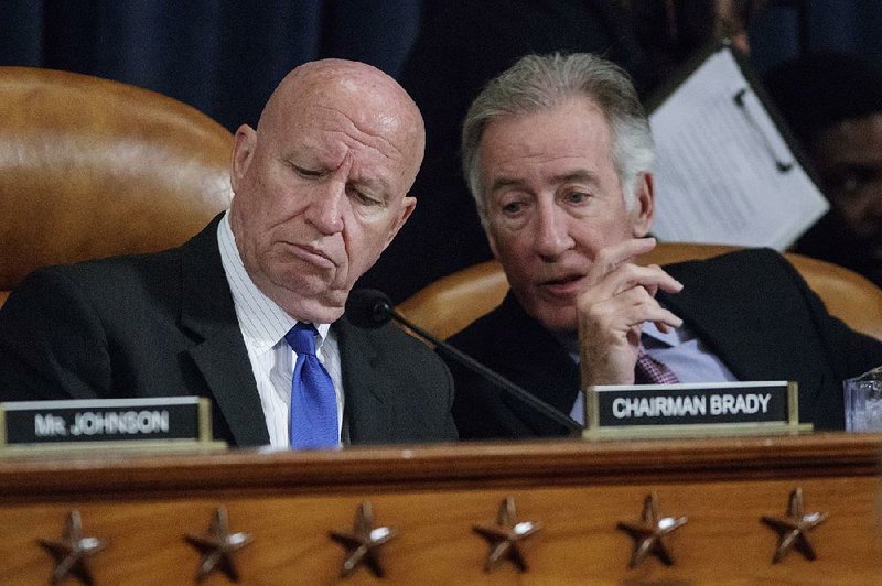 Rep. Richard Neal (right), D-Mass., speaks with House Ways and Means Committee Chairman Rep. Kevin Brady, R-Texas, about the GOP health care legislation during a session Wednesday. “This bill suffers from an identity crisis,” Neal, the top Democrat on the committee, said. “Is this health care, or is this a tax-cut bill?”