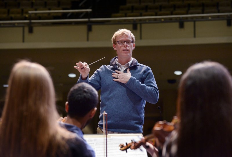 NWA Democrat-Gazette/BEN GOFF @NWABENGOFF
Jesse Collett, Bentonville High orchestra teacher, conducts Monday, Feb. 27, 2017, during rehearsal in the Arend Arts Center at Bentonville High School. The orchestra is traveling to New York to compete in The Orchestra Cup - National Orchestra Championships on Saturday. 
