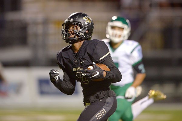 Kam'ron Mays-Hunt, Bentonville wide receiver, runs for a touchdown in the first quarter on Friday Sept. 30, 2016, during the game in Bentonville's Tiger Stadium.