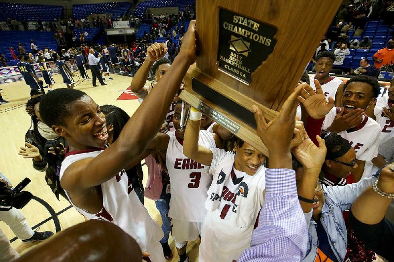 Members of the Earle team celebrate a second consecutive state championship after an 81-62 victory over Marked Tree on Thursday night at Bank of the Ozarks Arena in Hot Springs. More photos available at arkansasonline.com/galleries.
