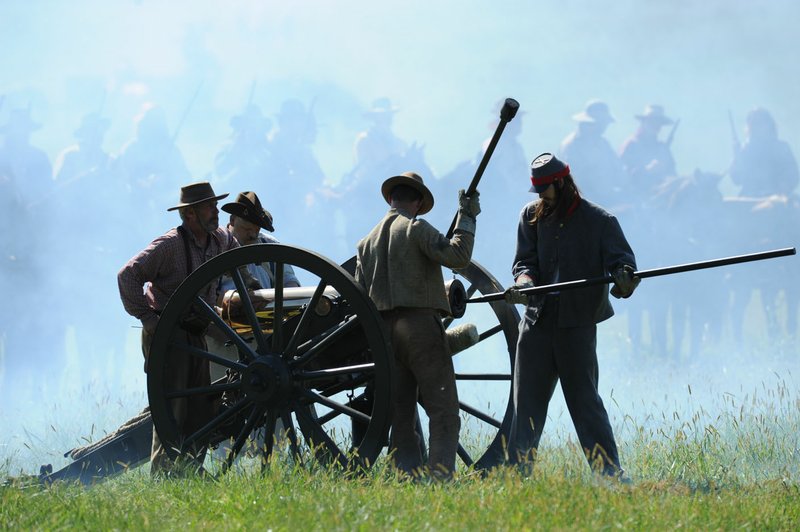 File Photo/ANDY SHUPE Soldiers prepare a cannon to be reloaded during a 2015 commemoration of the Civil War Battle of Pea Ridge. This year's 155th anniversary will be marked on Saturday.