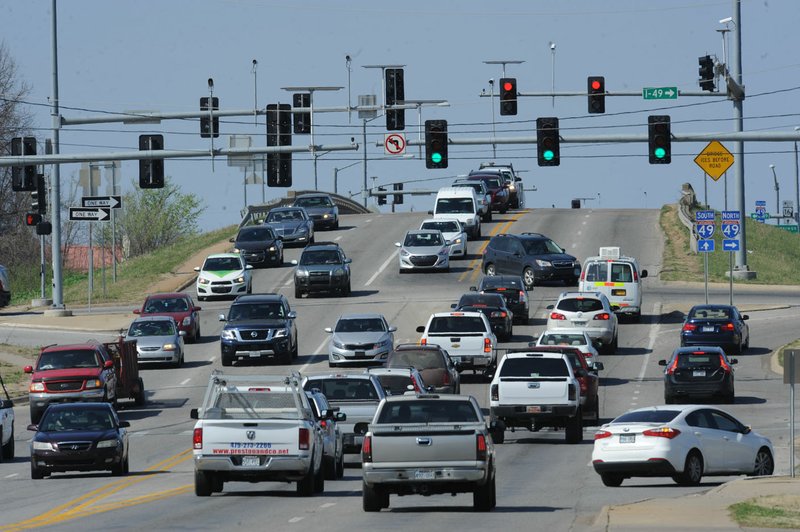 Traffic flows Thursday along Wedington Drive over Interstate 49 in Fayetteville. The Arkansas Highway and Transportation Department is developing a way to improve the intersection.