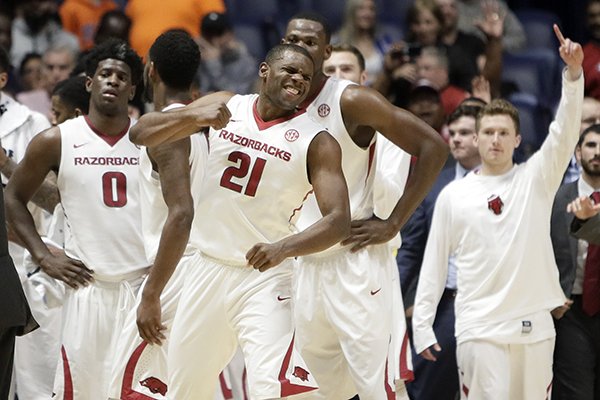 Arkansas guard Manuale Watkins (21) celebrates with teammates after Arkansas beat Mississippi 73-72 in an NCAA college basketball game at the Southeastern Conference tournament Friday, March 10, 2017, in Nashville, Tenn. (AP Photo/Wade Payne)

