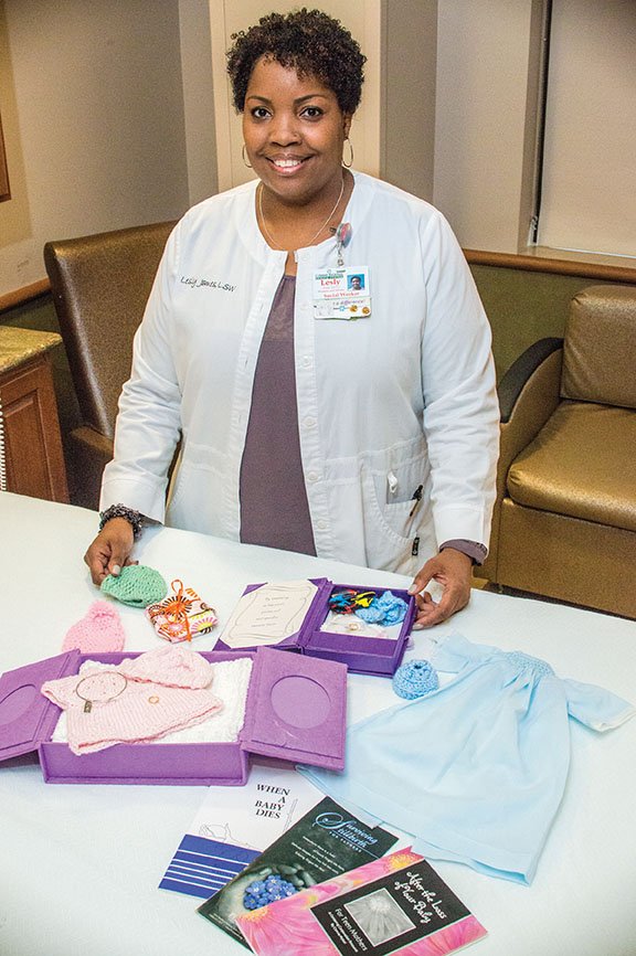 Lesly James, a licensed social worker and coordinator of the Conway Regional perinatal-bereavement 
program, shows some of the items, including clothing and booklets, that she gives grieving parents. A free 
support group, Healing Wings, is scheduled from 2-4 p.m. today at the Frauenthal Estate at Western and Louvenia avenues on the Conway Regional Medical Center campus. For more information, call James at (501) 513-5228 or (501) 697-5564.
