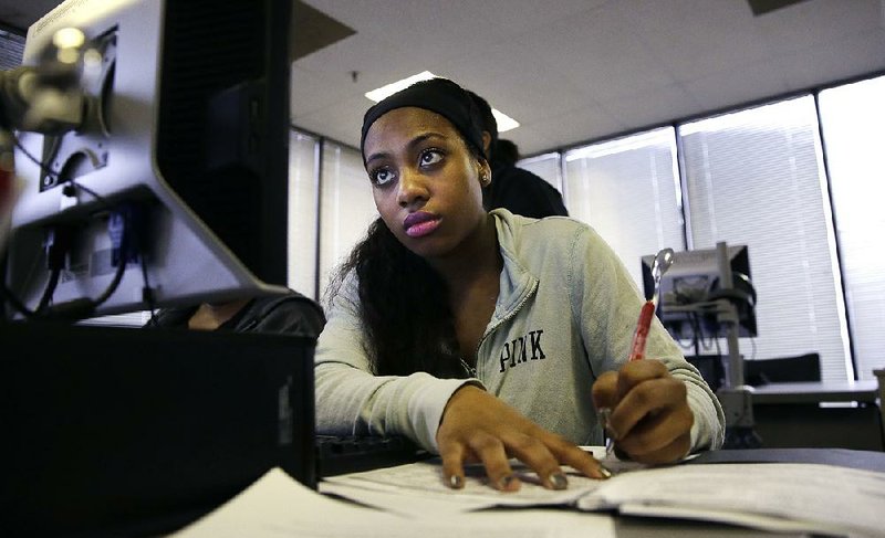 Job seeker Kiana Cupit attends a resume-writing class Friday at a Texas agency in Dallas. The government said that in February more people started job searches as they gained confidence in finding work. 
