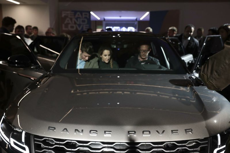 People check out the interior of the Range Rover Velar sport utility vehicle manufactured by Jaguar Land Rover Automotive Plc., during an event at the Design Museum in London last week. 