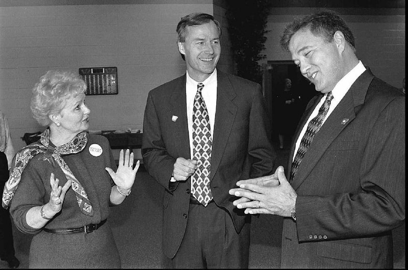 Asa Hutchinson (center) is shown Oct. 10, 1996, prior to a rowdy daylight saving time debate between himself, Ann Henry and Tony Joe Huffman.