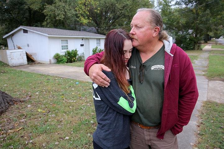 Chris Finley and daughter Caitlyn Finley reminisce outside the house where his son and her brother, Christopher Grant Finley, 31, died in 2015 after being shot by a Jonesboro police officer. About 25 percent of people shot by police in Arkansas in the past six years, including Grant Finley, struggled with mental illness, an Arkansas Democrat-Gazette investigation shows.