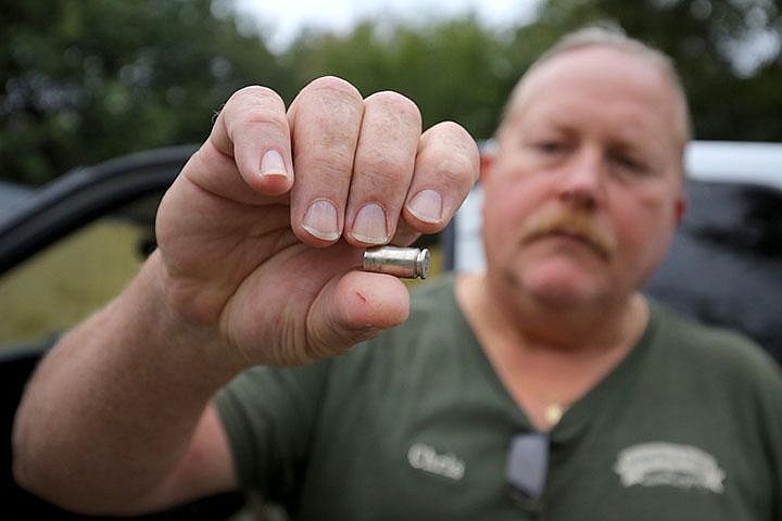 10/20/16
Arkansas Democrat-Gazette/STEPHEN B. THORNTON
Chris Finley holds one of the shell casings he found after at the scene after Jonesboro police shot and killed his son Christopher Grant Finley, 31,  at a  Jonesboro home. Chris keeps them in his truck's door. 
death by cop (DBC)