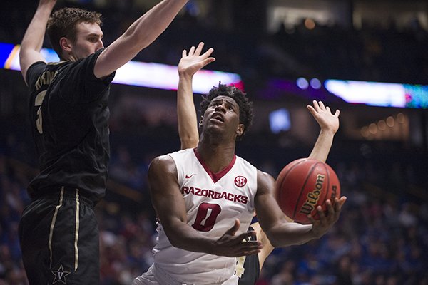 Arkansas' Jaylen Barford drives around Vanderbilt's Luke Kornet during an SEC Tournament game Saturday, March, 11, 2017, at Bridgestone Arena in Nashville, Tenn. Arkansas beat Vanderbilt 76-62 and will play Kentucky in the tournament championship game on Sunday.