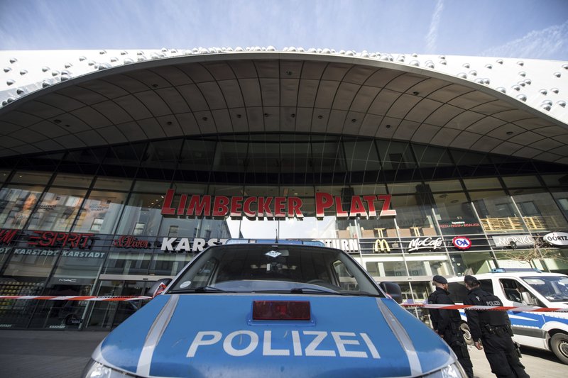Police guard in front of a shopping mall in Essen, Germany, Saturday, March 11, 2017. Police have ordered the shopping mall in the western German city of Essen not to open after receiving credible tips of an imminent attack.