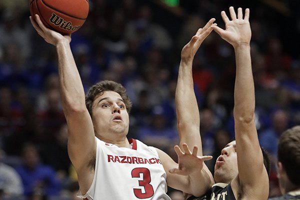 Arkansas guard Dusty Hannahs (3) shoots over Vanderbilt guard Nolan Cressler in the first half of an NCAA college basketball game in the semifinals of the Southeastern Conference tournament Saturday, March 11, 2017, in Nashville, Tenn. (AP Photo/Wade Payne)

