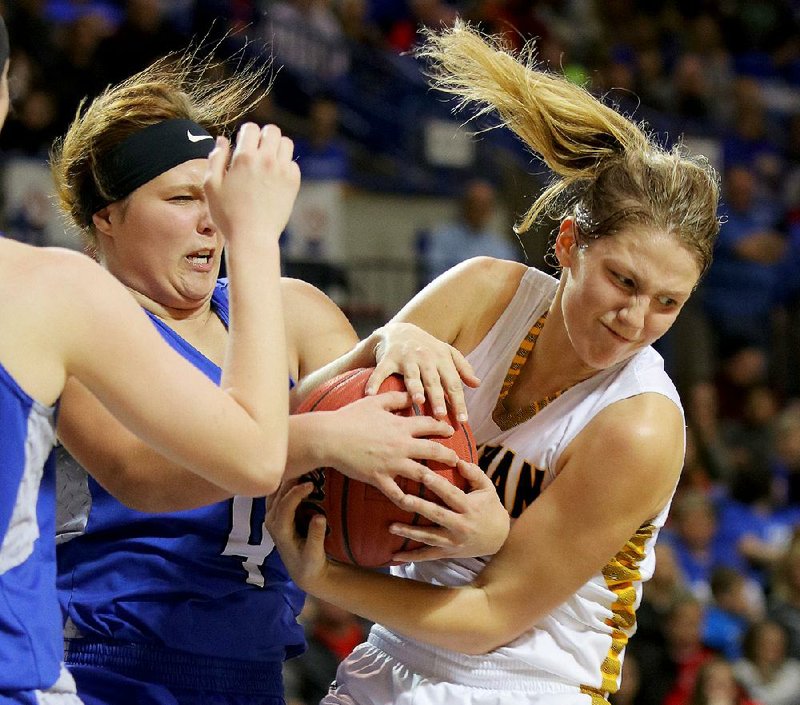 Hector’s Evelyn Riley (left) and Quitman’s Rieley Hooten (right) battle for a rebound during the Lady Bulldogs’ 45-22 victory in the Class 2A state tournament at Bank of the Ozarks Arena in Hot Springs on Saturday. More photos available at arkansasonline.com/galleries.