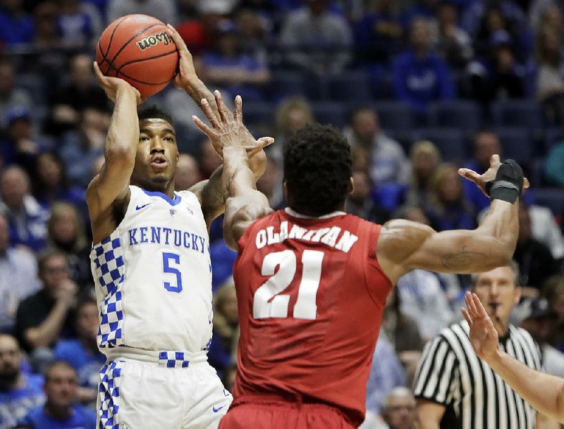 Kentucky guard Malik Monk (5) of Bentonville shoots over Alabama forward Bola Olaniyan (21) during the No. 8 Wildcats’ 79-74 victory over the Crimson Tide on Saturday in the semifinals of the SEC Tournament at Bridgestone Arena in Nashville, Tenn. Monk finished with 20 points on 6-of-14 shooting from the floor, including 2 of 5 three-pointers. 